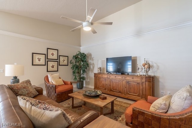 living room featuring ceiling fan and ornamental molding