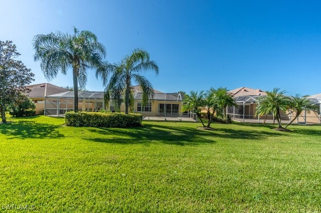 view of yard with a lanai