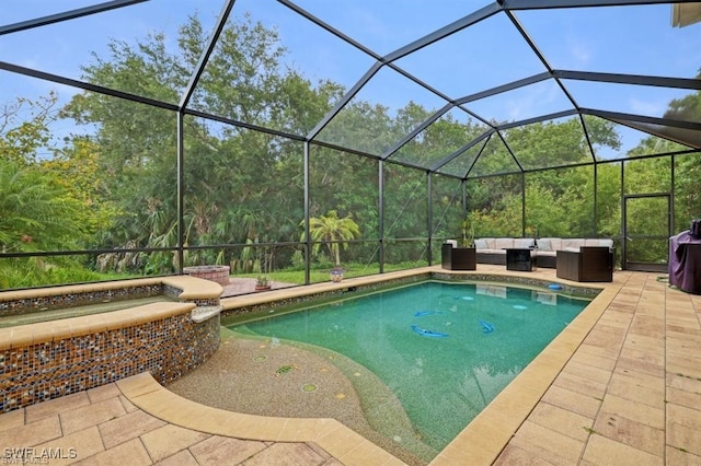 view of pool with a lanai, a patio area, and an outdoor hangout area