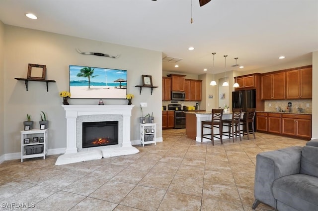 tiled living room with ceiling fan