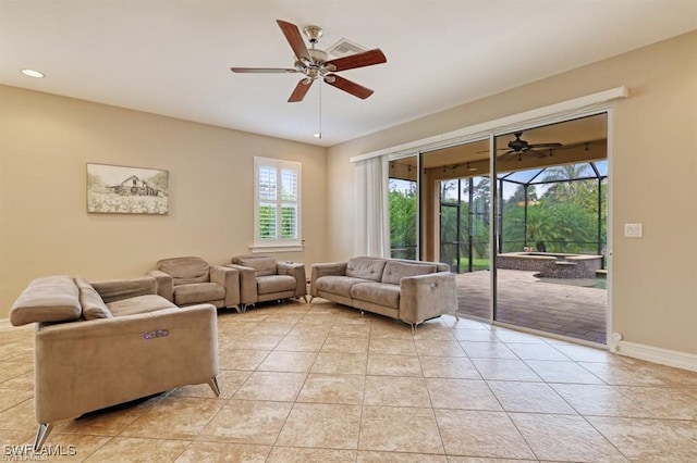 living room featuring ceiling fan and light tile patterned flooring