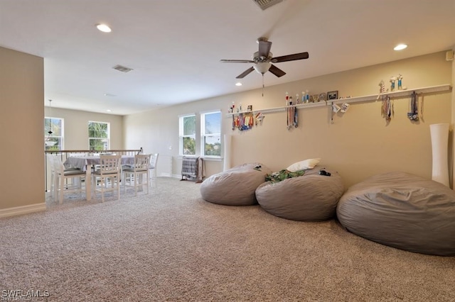 interior space featuring carpet and ceiling fan