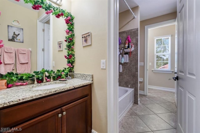 3290 Banyon Hollow Loop, North Fort Myers, FL 33903 - full bath featuring vanity, tile patterned floors, baseboards, and bathing tub / shower combination