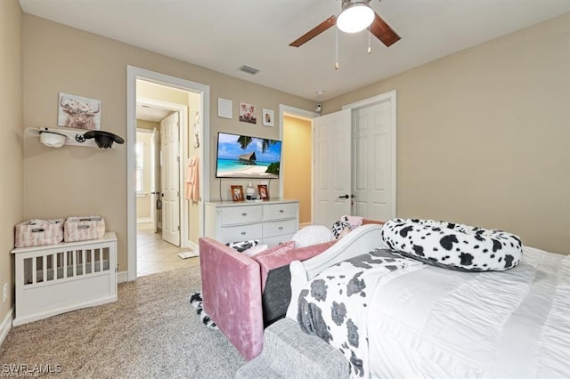 3290 Banyon Hollow Loop, North Fort Myers, FL 33903 - bedroom featuring baseboards, a ceiling fan, light carpet, and ensuite bathroom
