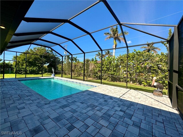 view of pool featuring a lanai and a patio