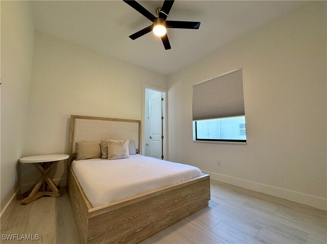 bedroom featuring light wood-type flooring and ceiling fan