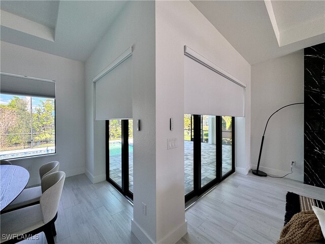 interior space with french doors and light hardwood / wood-style flooring