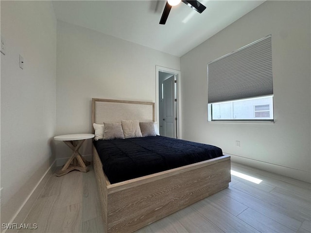 1827 SW 39th St, Cape Coral, FL 33914 - bedroom with wood finished floors, ceiling fan, and baseboards