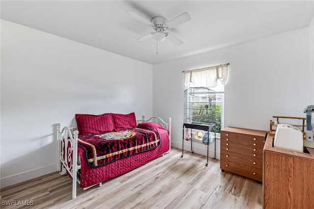 bedroom with ceiling fan and light hardwood / wood-style floors