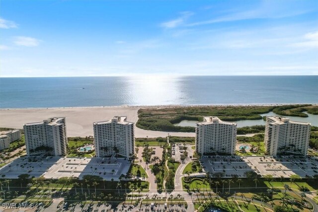 aerial view featuring a water view and a view of the beach