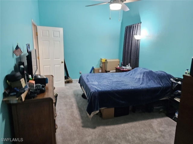 bedroom featuring ceiling fan and carpet floors