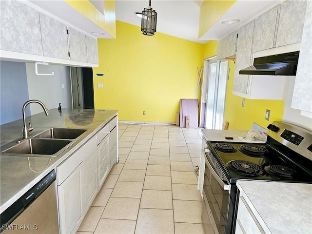 2935 SW 1st Pl, Cape Coral, FL 33914 - kitchen featuring light tile patterned flooring, a sink, light countertops, under cabinet range hood, and appliances with stainless steel finishes