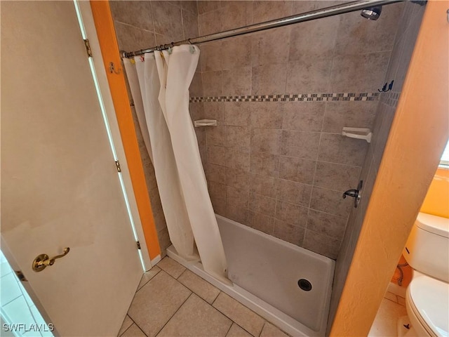 2935 SW 1st Pl, Cape Coral, FL 33914 - bathroom featuring toilet, a shower stall, and tile patterned flooring