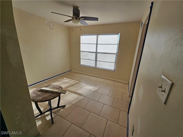 2935 SW 1st Pl, Cape Coral, FL 33914 - spare room featuring light tile patterned flooring, baseboards, and ceiling fan