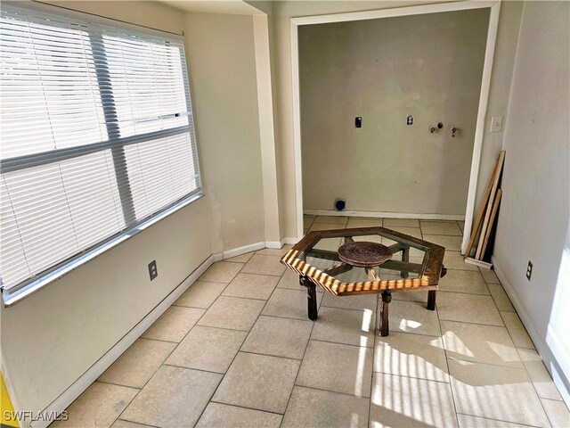 2935 SW 1st Pl, Cape Coral, FL 33914 - interior space featuring light tile patterned flooring, baseboards, and a wealth of natural light