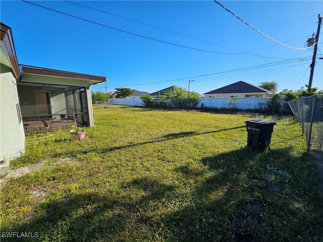 2935 SW 1st Pl, Cape Coral, FL 33914 - view of yard with fence and a sunroom