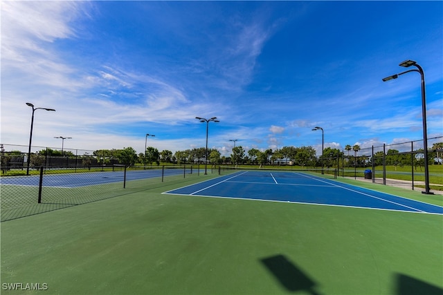 view of tennis court with basketball court