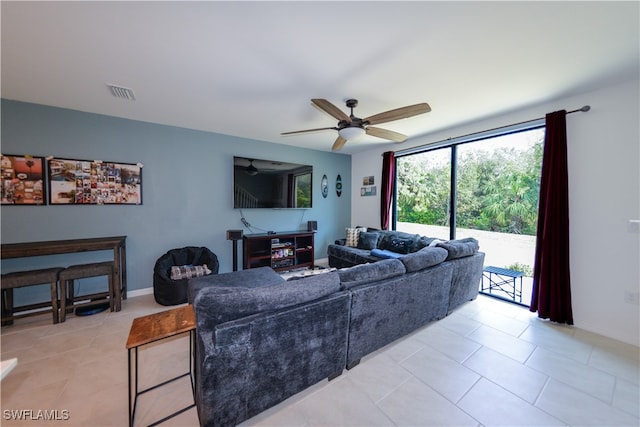 living room with light tile patterned floors and ceiling fan