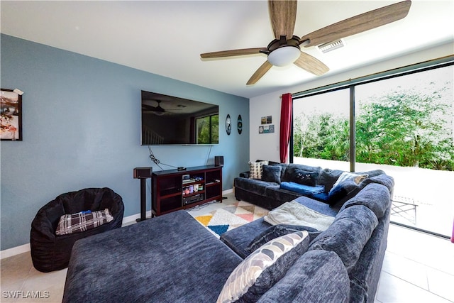 living room with ceiling fan and light tile patterned floors