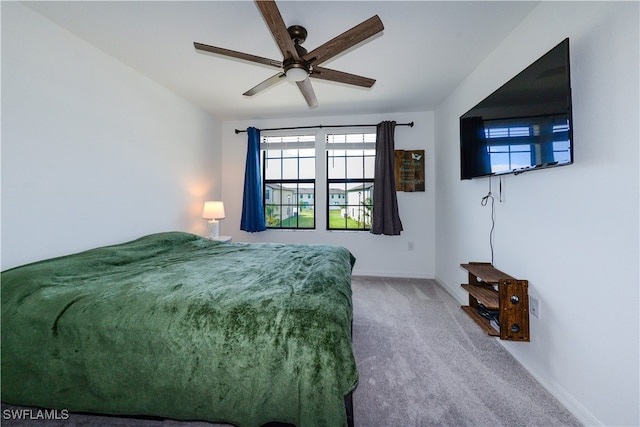 carpeted bedroom featuring ceiling fan