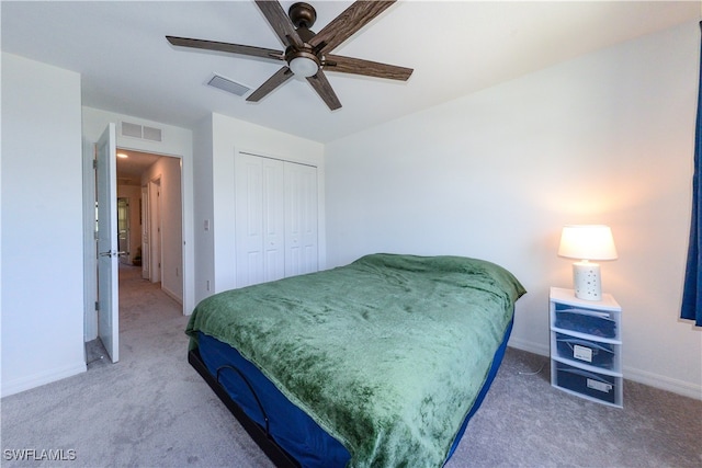 bedroom with carpet flooring, a closet, and ceiling fan