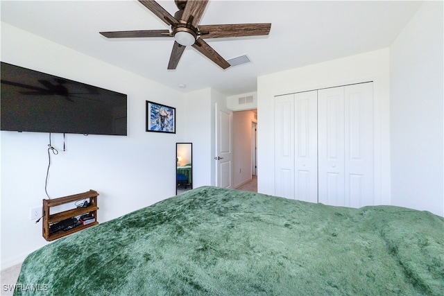 unfurnished bedroom featuring carpet flooring, ceiling fan, and a closet