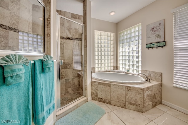 bathroom with tile patterned flooring and plus walk in shower