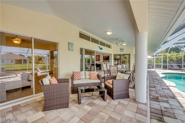 view of patio with glass enclosure and an outdoor hangout area