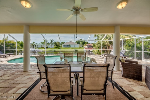 sunroom / solarium featuring a pool and ceiling fan