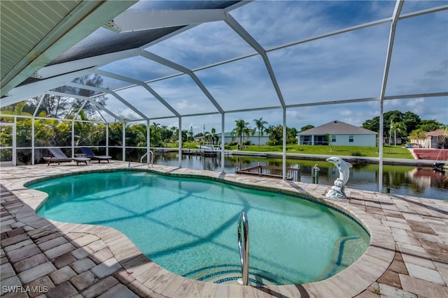 view of pool with a lanai, a patio area, and a water view