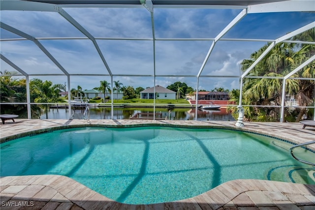 view of swimming pool with a water view, glass enclosure, and a patio area