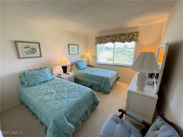 carpeted bedroom featuring a textured ceiling