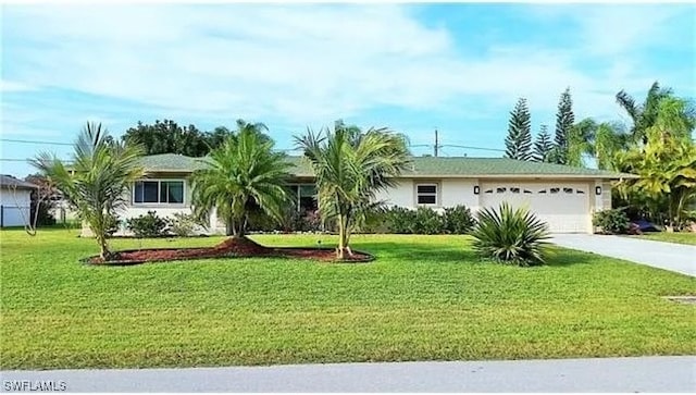 ranch-style house with a garage and a front lawn