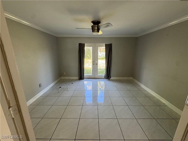 spare room featuring light tile patterned floors, ornamental molding, and french doors