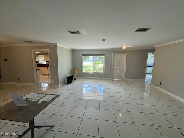 unfurnished room with light tile patterned flooring and crown molding