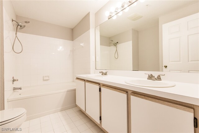 full bathroom with tile patterned flooring, vanity, toilet, and tiled shower / bath combo