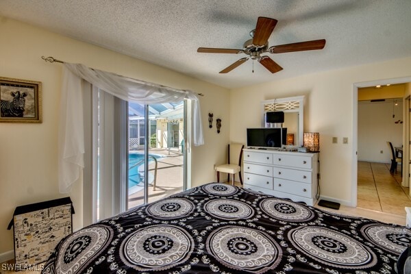 tiled bedroom featuring a textured ceiling, access to outside, and ceiling fan