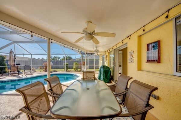 exterior space with a lanai, a patio area, and ceiling fan