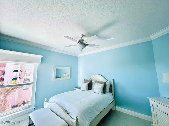 bedroom with a textured ceiling, ceiling fan, and crown molding