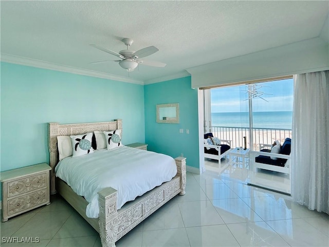 bedroom featuring ceiling fan, a water view, light tile patterned floors, and ornamental molding