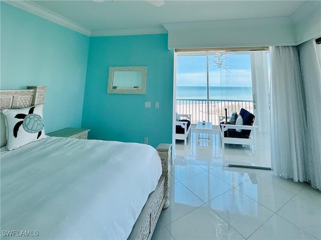 tiled bedroom featuring a water view, a beach view, access to exterior, and crown molding