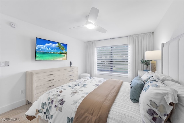 bedroom featuring light hardwood / wood-style floors and ceiling fan