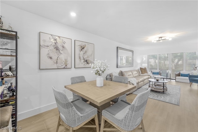 dining space featuring light hardwood / wood-style flooring