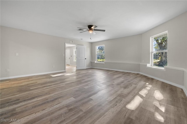 empty room featuring ceiling fan and wood-type flooring