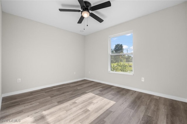 spare room featuring ceiling fan and wood-type flooring