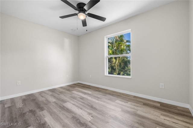 empty room featuring ceiling fan and light hardwood / wood-style floors