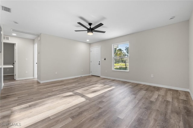 unfurnished room with ceiling fan and light hardwood / wood-style floors