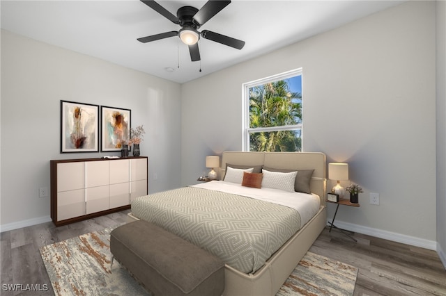 bedroom featuring ceiling fan and light hardwood / wood-style floors