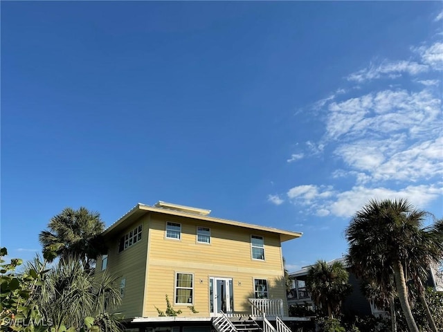 rear view of property with a deck