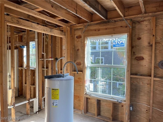 utility room featuring electric water heater